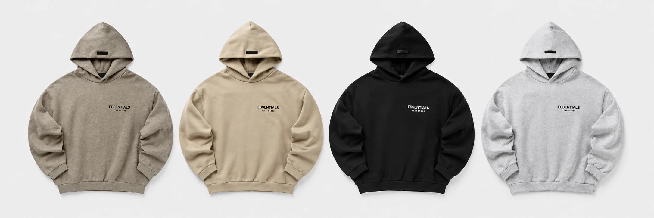 Čtyři mikiny Fear of God Essentials ve studiové kompozici